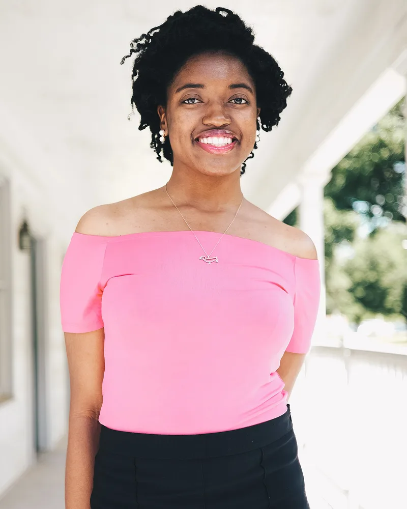 Original photo of a woman in a pink top on a white porch